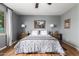 Serene bedroom featuring hardwood floors, a decorative painting and soft, natural light at 714 W Desert Hills Dr, San Tan Valley, AZ 85143