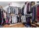 Walk-in closet with built-in shelving and ample storage space for clothes and accessories at 714 W Desert Hills Dr, San Tan Valley, AZ 85143