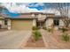 Charming two-story home with a well-manicured front yard and desert-friendly landscaping at 714 W Desert Hills Dr, San Tan Valley, AZ 85143