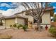 Inviting home featuring a well-manicured front yard and a charming wishing well feature at 714 W Desert Hills Dr, San Tan Valley, AZ 85143