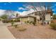A beautiful home featuring an expertly xeriscaped front yard and inviting curb appeal at 714 W Desert Hills Dr, San Tan Valley, AZ 85143
