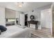 Comfortable bedroom with a dresser, closet and a large window at 7751 E Glenrosa Ave # A1, Scottsdale, AZ 85251