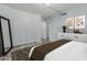Bedroom offers a large closet, modern flooring, and contemporary style at 7751 E Glenrosa Ave # A1, Scottsdale, AZ 85251