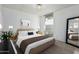 Bright bedroom with white brick walls, a large window, neutral decor, and recessed lighting at 7751 E Glenrosa Ave # A1, Scottsdale, AZ 85251
