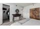 Bright bedroom features wood-look floors, modern decor, and convenient closet access at 7751 E Glenrosa Ave # A1, Scottsdale, AZ 85251