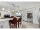 Bright kitchen with a center island and seating, connected to the living area at 7751 E Glenrosa Ave # A1, Scottsdale, AZ 85251