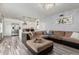 Spacious living room with a modern open floor plan and wood-look tile flooring at 7751 E Glenrosa Ave # A1, Scottsdale, AZ 85251