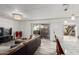 Open-concept living area with a large sliding door for natural light and outdoor access at 7751 E Glenrosa Ave # A1, Scottsdale, AZ 85251