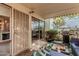 Covered patio with grill and seating, offering a great outdoor living space at 7751 E Glenrosa Ave # A1, Scottsdale, AZ 85251