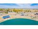 An aerial view showcases the community lake, park, and playground amenities of this vibrant neighborhood at 8335 W Berridge Ln, Glendale, AZ 85305