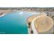 Aerial view of a lake offering walking paths and shaded picnic spots at 8335 W Berridge Ln, Glendale, AZ 85305