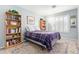 This bedroom is equipped with a ceiling fan, plantation shutters, and a bookcase at 8335 W Berridge Ln, Glendale, AZ 85305