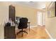 This is a bedroom with laminate wood flooring used as an office at 8335 W Berridge Ln, Glendale, AZ 85305