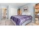 This is a comfortable bedroom with a bookshelf and a light gray carpet at 8335 W Berridge Ln, Glendale, AZ 85305