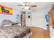 This is a bedroom with laminate wood flooring, ample storage, and closet space at 8335 W Berridge Ln, Glendale, AZ 85305