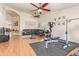 Large bonus room with a ceiling fan, wood floors, and ample space for activities at 8335 W Berridge Ln, Glendale, AZ 85305