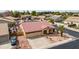 Lovely single-story home showcasing a three-car garage, desert landscaping, and a circular driveway at 8335 W Berridge Ln, Glendale, AZ 85305