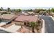 Attractive single-Gathering home with a three-car garage, xeriscaped yard, and mature palm trees at 8335 W Berridge Ln, Glendale, AZ 85305