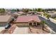 Charming single-story home featuring a three-car garage, well-manicured landscaping, and a welcoming entrance at 8335 W Berridge Ln, Glendale, AZ 85305