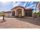 Charming single-Gathering home with a welcoming entrance and a well-maintained desert landscape at 8335 W Berridge Ln, Glendale, AZ 85305