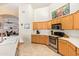 Kitchen featuring stainless steel appliances, lots of counter space, and bright, recessed lighting at 8335 W Berridge Ln, Glendale, AZ 85305
