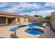 Gorgeous backyard pool with stone decking, solar panels and secure fencing for privacy at 8335 W Berridge Ln, Glendale, AZ 85305