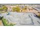 Aerial shot of a modern skate park featuring smooth concrete ramps and challenging obstacles at 8335 W Berridge Ln, Glendale, AZ 85305