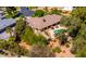 Aerial view of a house showing a backyard pool, patio, and mature trees at 8649 S Willow Dr, Tempe, AZ 85284