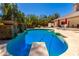 Sparkling pool with stone accents offers a relaxing retreat in this desert oasis at 8649 S Willow Dr, Tempe, AZ 85284