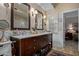 Elegant bathroom with a double vanity, framed mirrors, and plentiful storage space at 8649 S Willow Dr, Tempe, AZ 85284