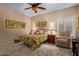 Serene bedroom featuring a cozy bed, natural lighting, and a relaxing sitting area with a comfortable recliner at 8649 S Willow Dr, Tempe, AZ 85284