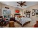 Comfortable bedroom featuring neutral colors, decorative accents, and a ceiling fan at 8649 S Willow Dr, Tempe, AZ 85284