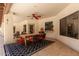 A covered patio with dining area and outdoor lighting offers a relaxing outdoor space at 8649 S Willow Dr, Tempe, AZ 85284