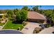 Aerial view of a charming home with mature landscaping and a spacious circular driveway at 8649 S Willow Dr, Tempe, AZ 85284