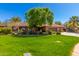 Charming single story brick home with a lush green lawn and mature landscaping at 8649 S Willow Dr, Tempe, AZ 85284