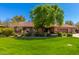 Charming single-story home with lush green lawn, mature trees, and brick exterior at 8649 S Willow Dr, Tempe, AZ 85284