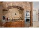 Kitchen area with granite countertops, stainless steel ovens, and decorative tile backsplash at 8649 S Willow Dr, Tempe, AZ 85284
