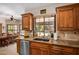 Kitchen area with granite countertops, stainless steel sink, and breakfast nook at 8649 S Willow Dr, Tempe, AZ 85284