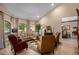 Bright living room with a vaulted ceiling, large windows, and comfortable furniture at 8649 S Willow Dr, Tempe, AZ 85284