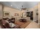 Spacious living room featuring a plush sofa set, ceiling fan, and decorative rug at 8649 S Willow Dr, Tempe, AZ 85284