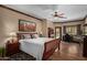 Bright main bedroom with hardwood floors, ceiling fan, and an attached sitting area at 8649 S Willow Dr, Tempe, AZ 85284