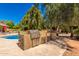 Outdoor kitchen featuring a stainless steel grill, a granite countertop, and plenty of cabinet space at 8649 S Willow Dr, Tempe, AZ 85284