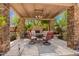 Inviting outdoor seating under a pergola, featuring comfortable chairs around a table at 8649 S Willow Dr, Tempe, AZ 85284