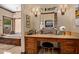 Elegant vanity area with a beautiful makeup table, a mirror, and a bathtub at 8649 S Willow Dr, Tempe, AZ 85284