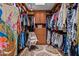 Spacious walk-in closet with custom shelving, drawers, and ample storage for clothing and accessories at 8649 S Willow Dr, Tempe, AZ 85284