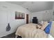 Spacious bedroom with plush bed, dark furniture, and bright natural light at 8700 E University Dr # 1947, Mesa, AZ 85207