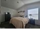 Cozy bedroom with comfortable bed, dark furniture, and natural light at 8700 E University Dr # 1947, Mesa, AZ 85207