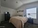 Serene bedroom featuring a cozy bed with quilt, neutral walls, and natural light, creating a relaxing atmosphere at 8700 E University Dr # 1947, Mesa, AZ 85207