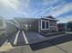 A well-maintained exterior with a carport provides convenient parking and curb appeal at 8700 E University Dr # 1947, Mesa, AZ 85207