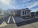 Charming home exterior featuring a carport, well-maintained landscaping and appealing architectural details at 8700 E University Dr # 1947, Mesa, AZ 85207